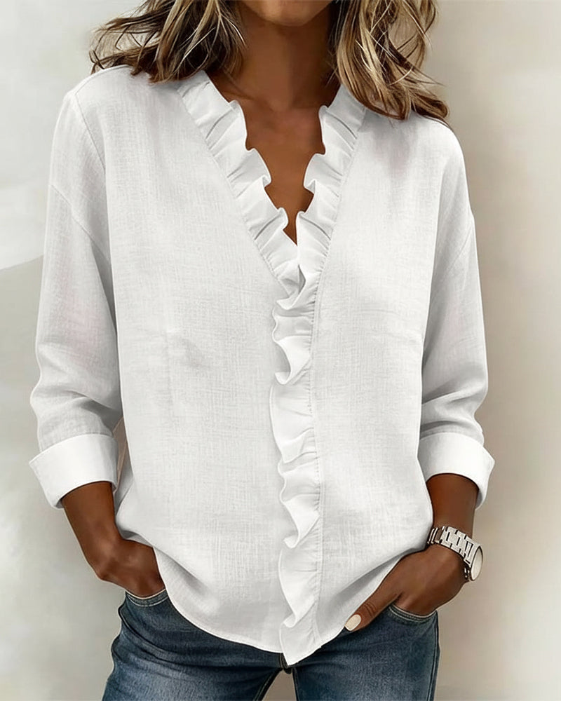 JOANNA | Blusa con escote en V y volante
