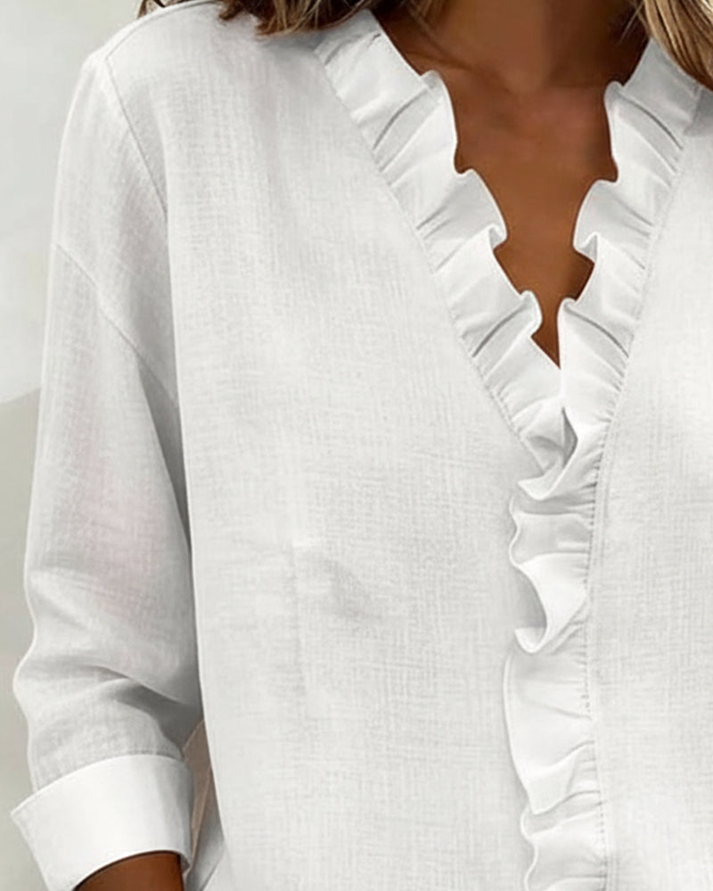 JOANNA | Blusa con escote en V y volante